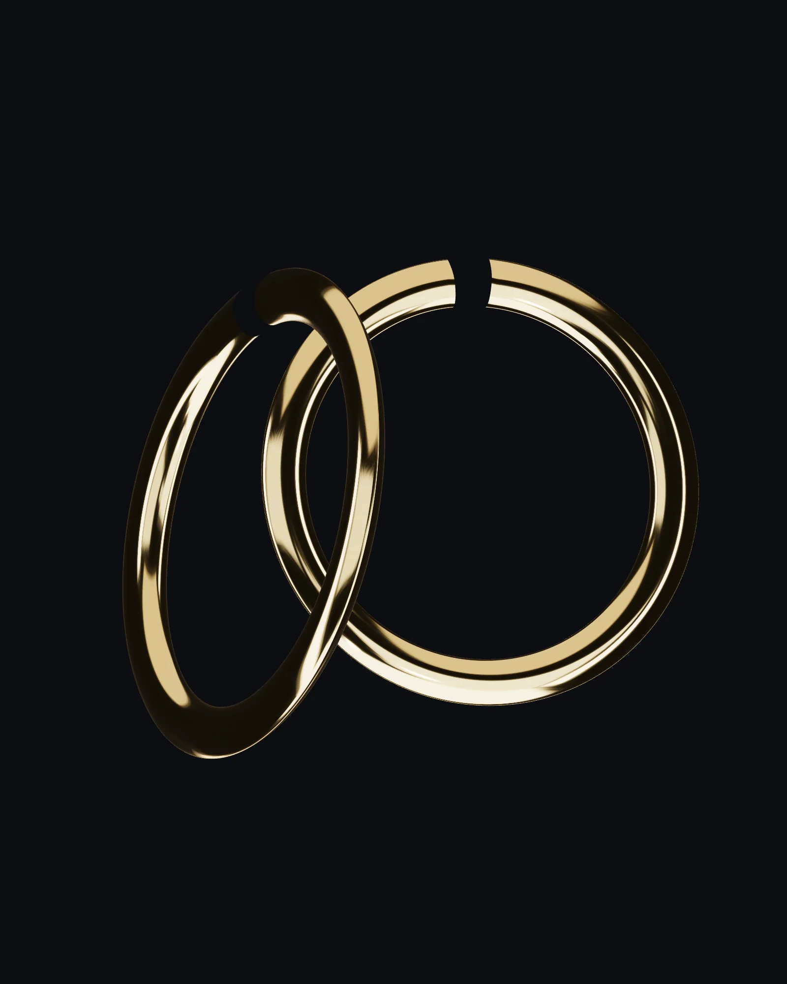 Halo hoops in yellow gold against a dark background.